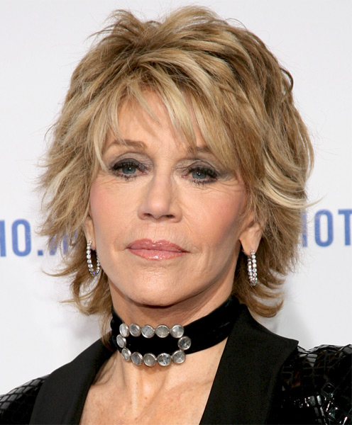 Jane Fonda medium layered blonde messy hairstyle with bangs for older women over 60