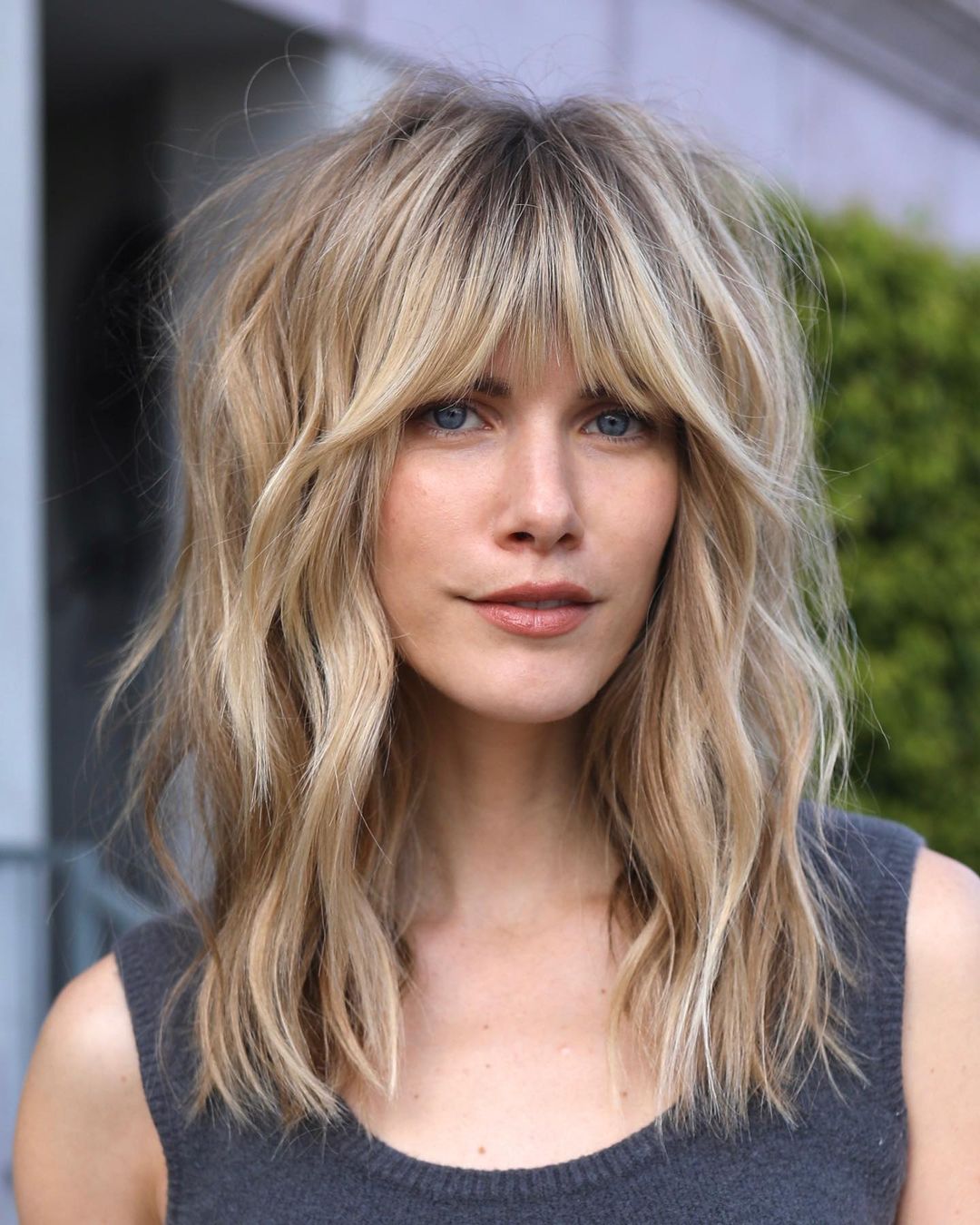 Mid length Shag hairstyle with bangs